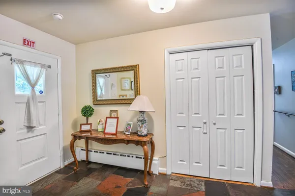 a bedroom with furniture and a window