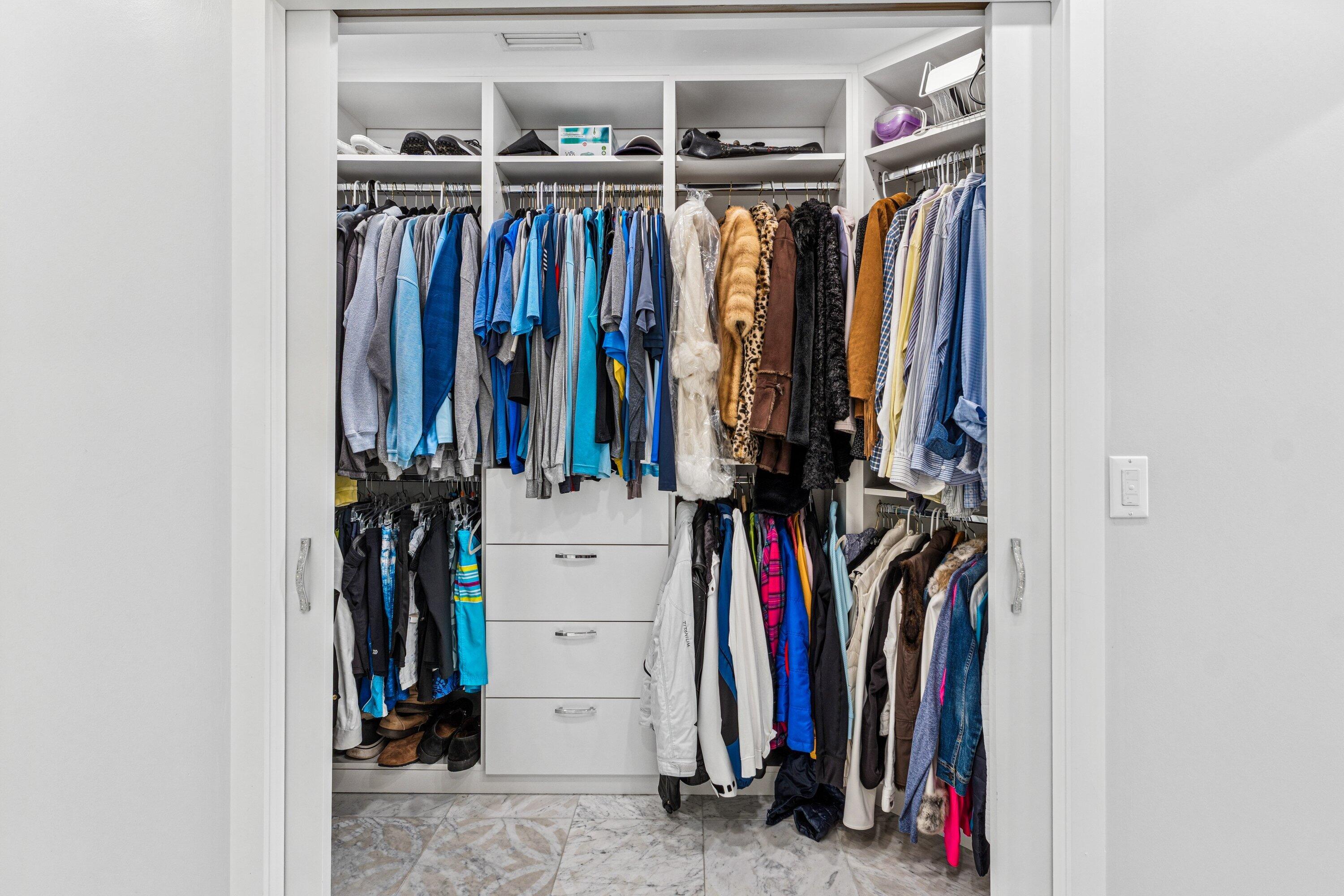 5183 Northwest 25th Way Boca Raton, FL 33496 - Photo 20 of 73 a view of walk in closet with clothes
