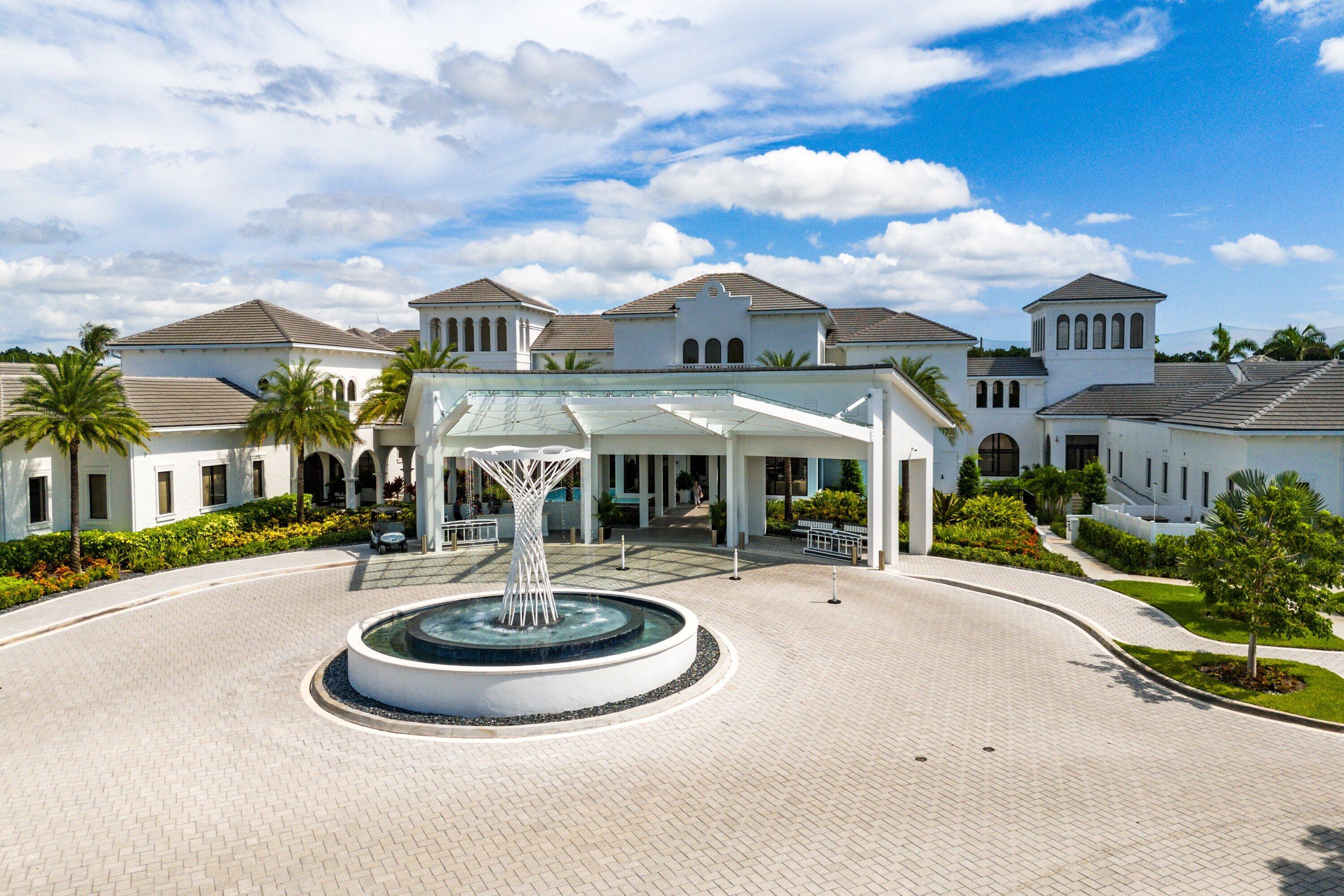 5183 Northwest 25th Way Boca Raton, FL 33496 - Photo 56 of 73 a front view of a house with entertaining space fire pit and outdoor seating