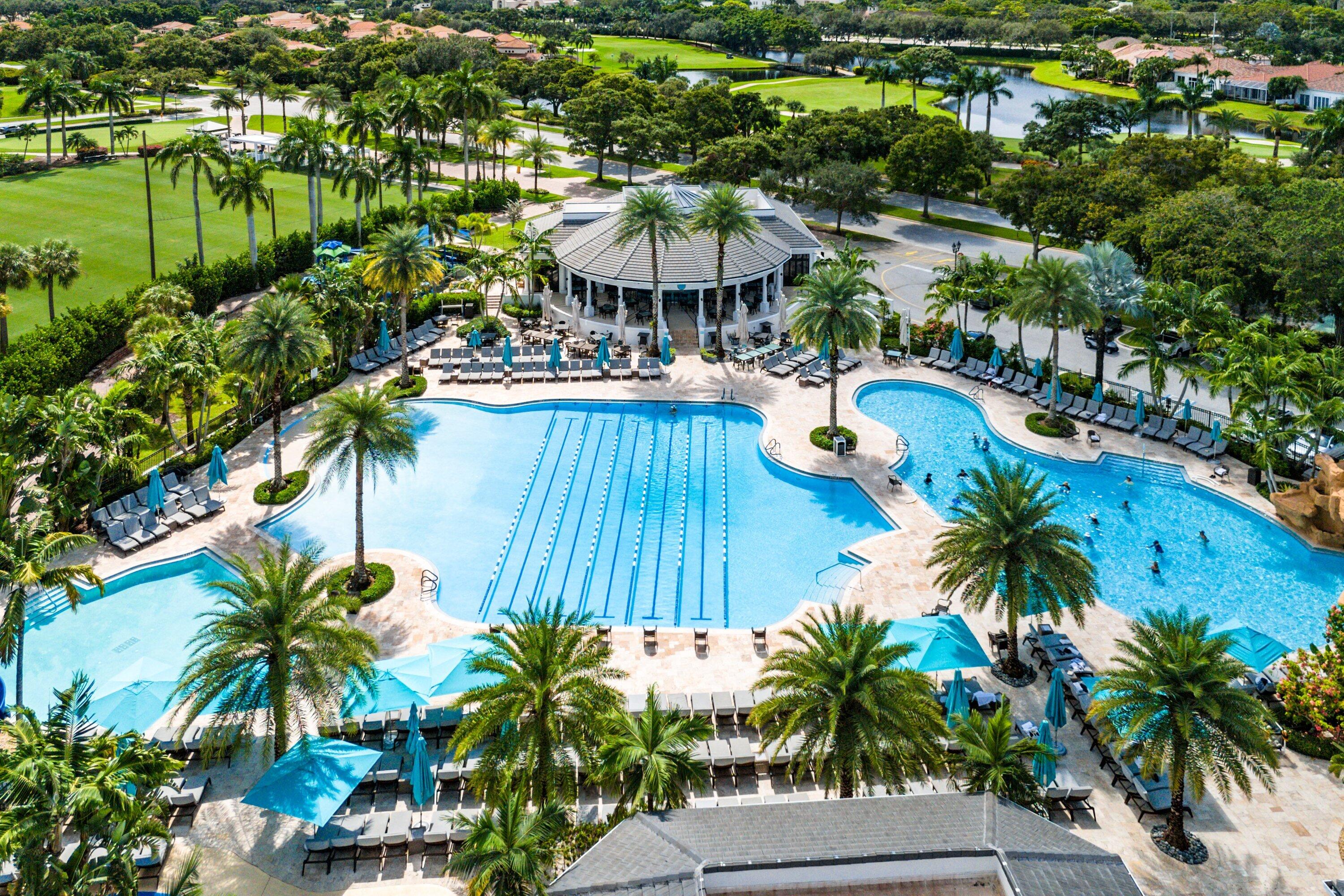 5183 Northwest 25th Way Boca Raton, FL 33496 - Photo 64 of 73 a view of a swimming pool with a patio and a garden