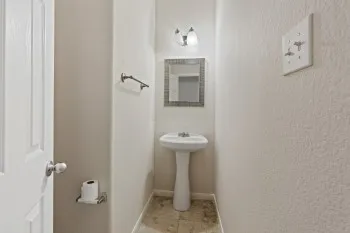 a bathroom with a sink and toilet