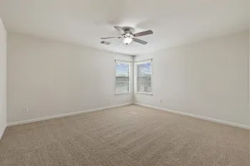 a view of an empty room with a window