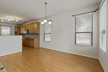 a view of a kitchen with a sink cabinets and wooden floor
