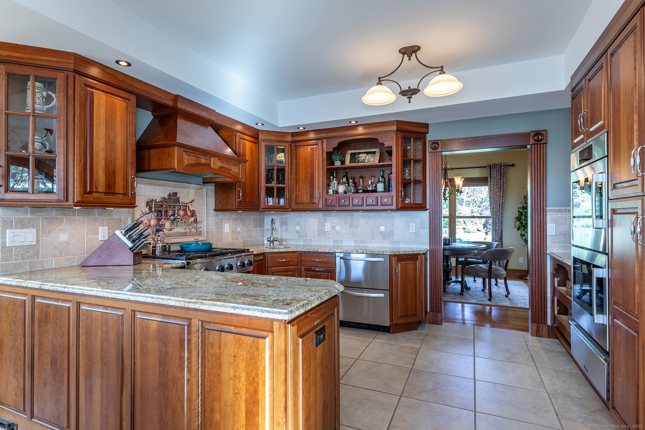 8 Bobcat Lane Warren, CT 06754 - Photo 11 of 40 a kitchen with a stove a sink and a microwave