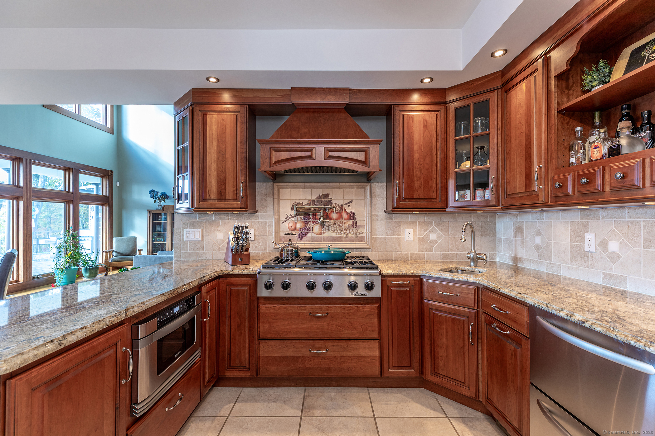 8 Bobcat Lane Warren, CT 06754 - Photo 13 of 40 a kitchen with stainless steel appliances granite countertop a stove a sink and a microwave