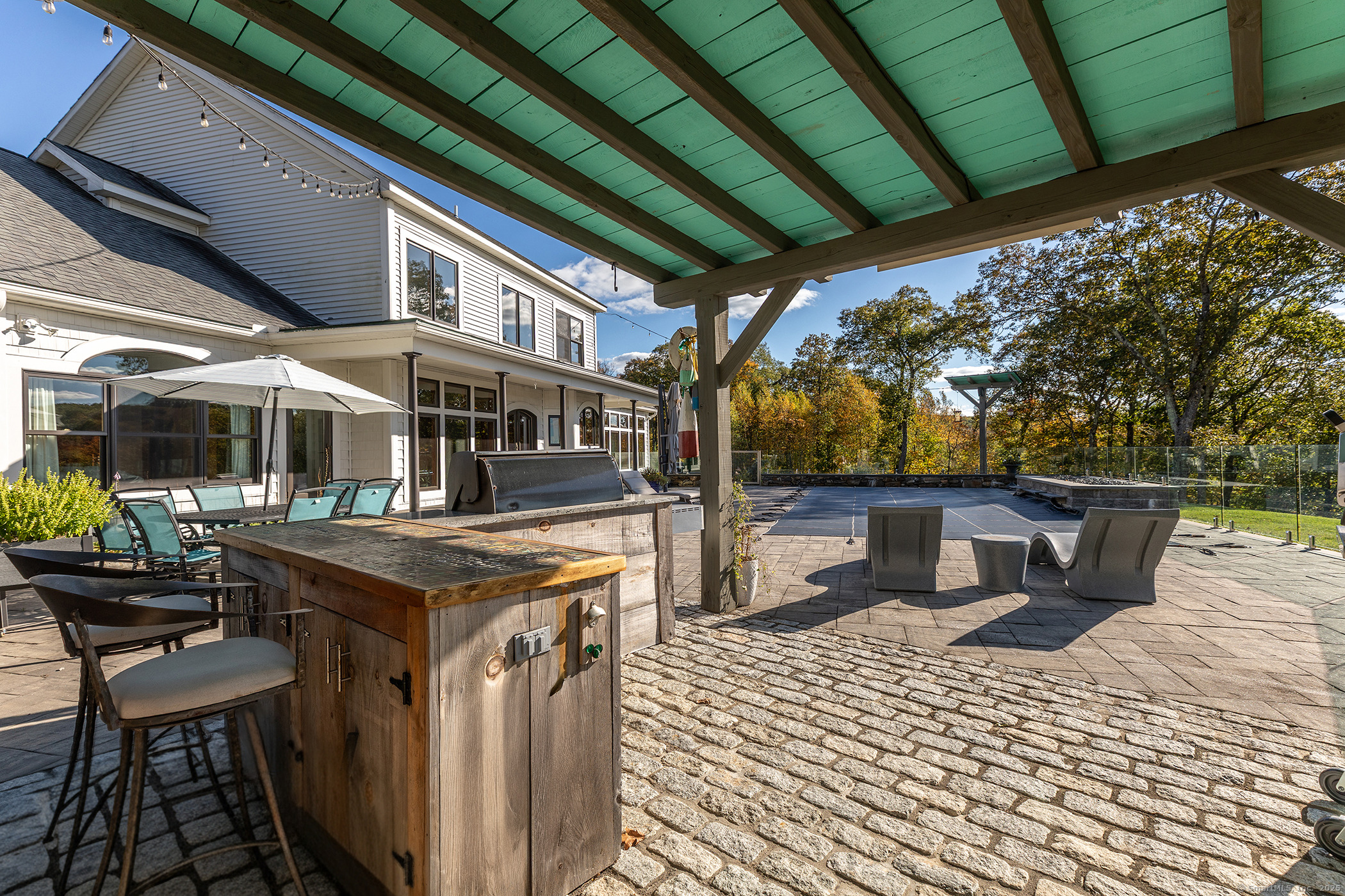 8 Bobcat Lane Warren, CT 06754 - Photo 21 of 40 a view of a patio with a table and chairs