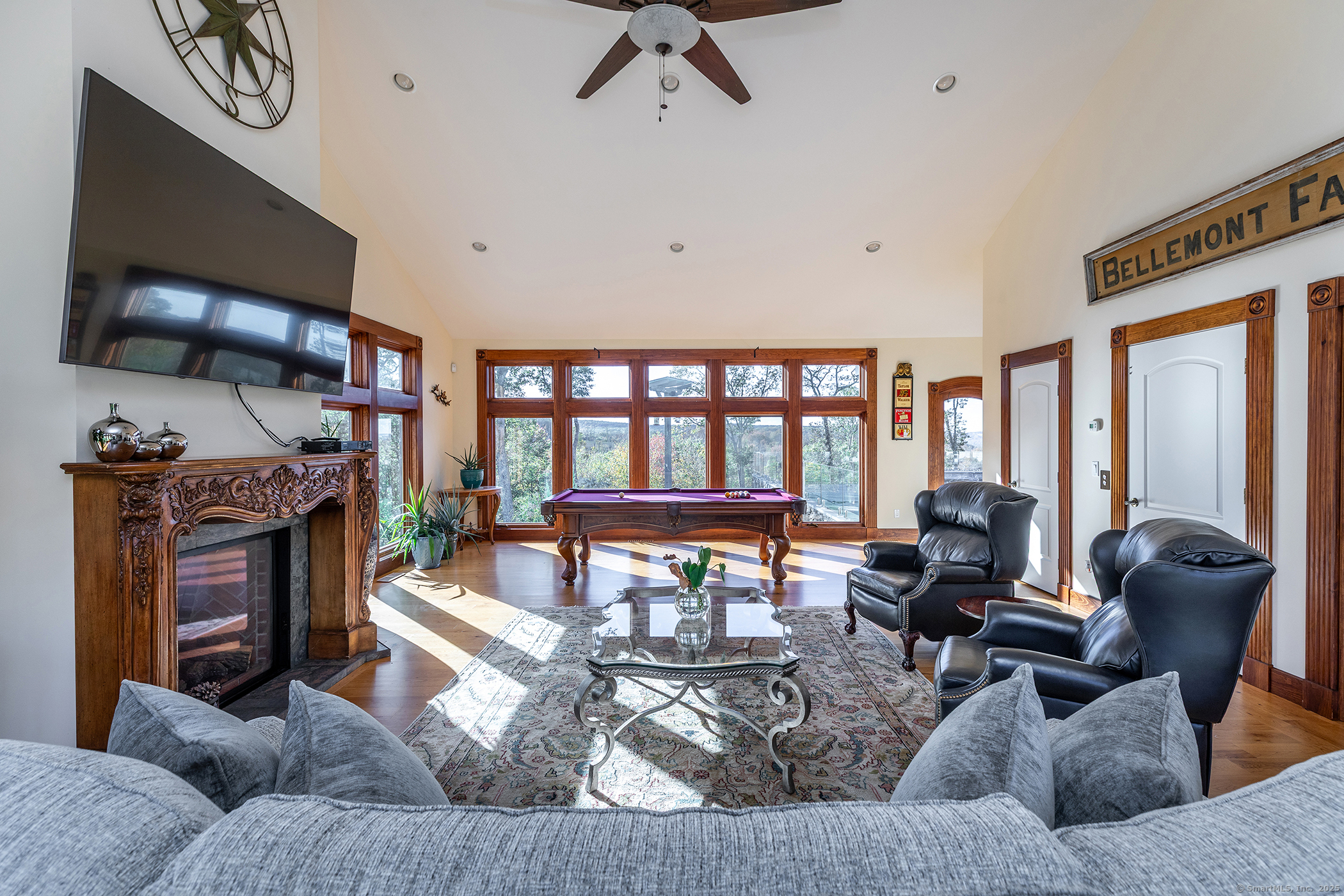 8 Bobcat Lane Warren, CT 06754 - Photo 26 of 40 a living room with furniture and a flat screen tv