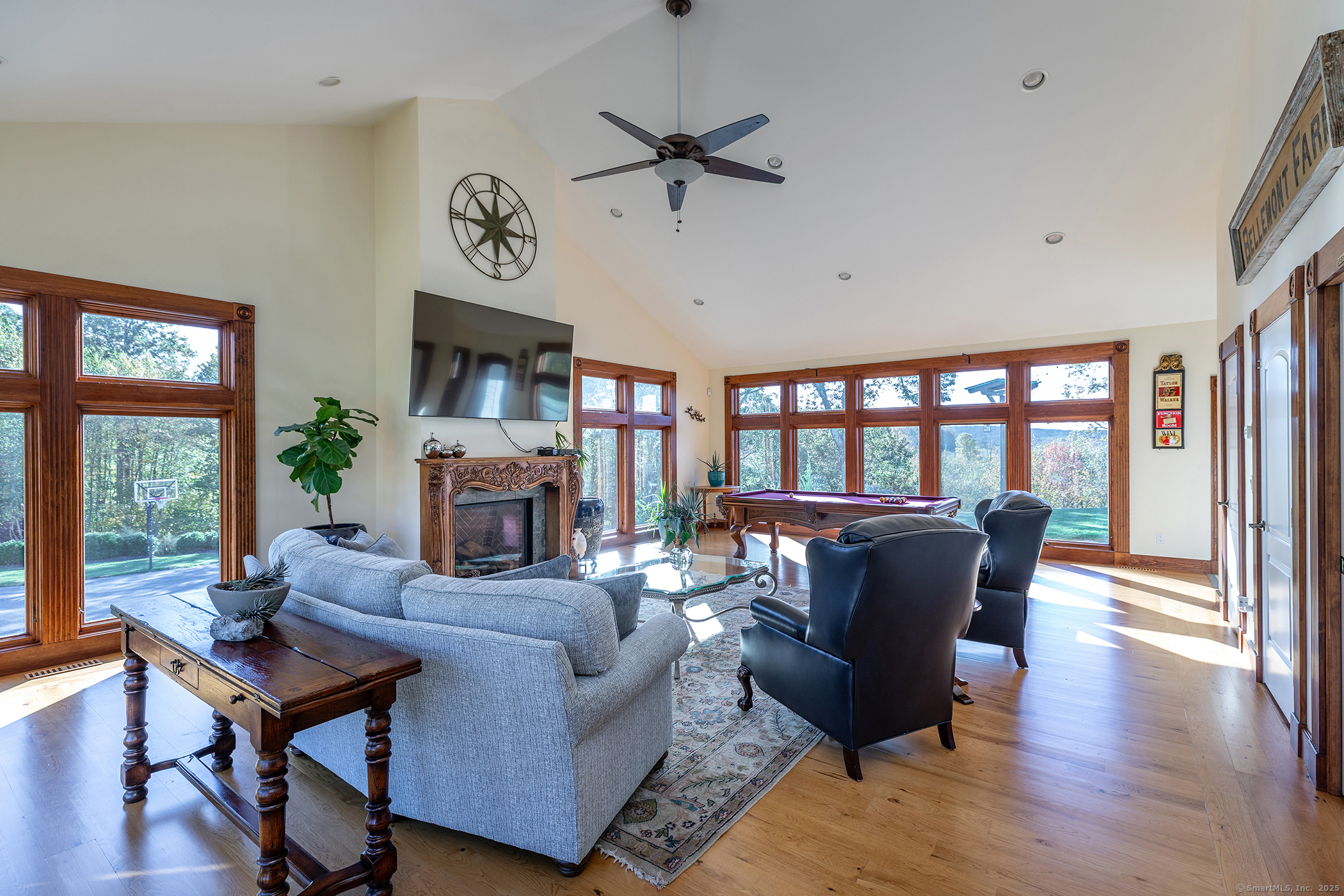 8 Bobcat Lane Warren, CT 06754 - Photo 27 of 40 a living room with fireplace furniture and a large window
