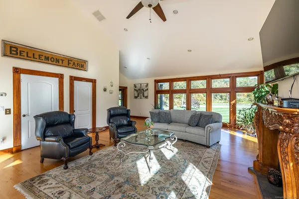 a living room with furniture and a large window