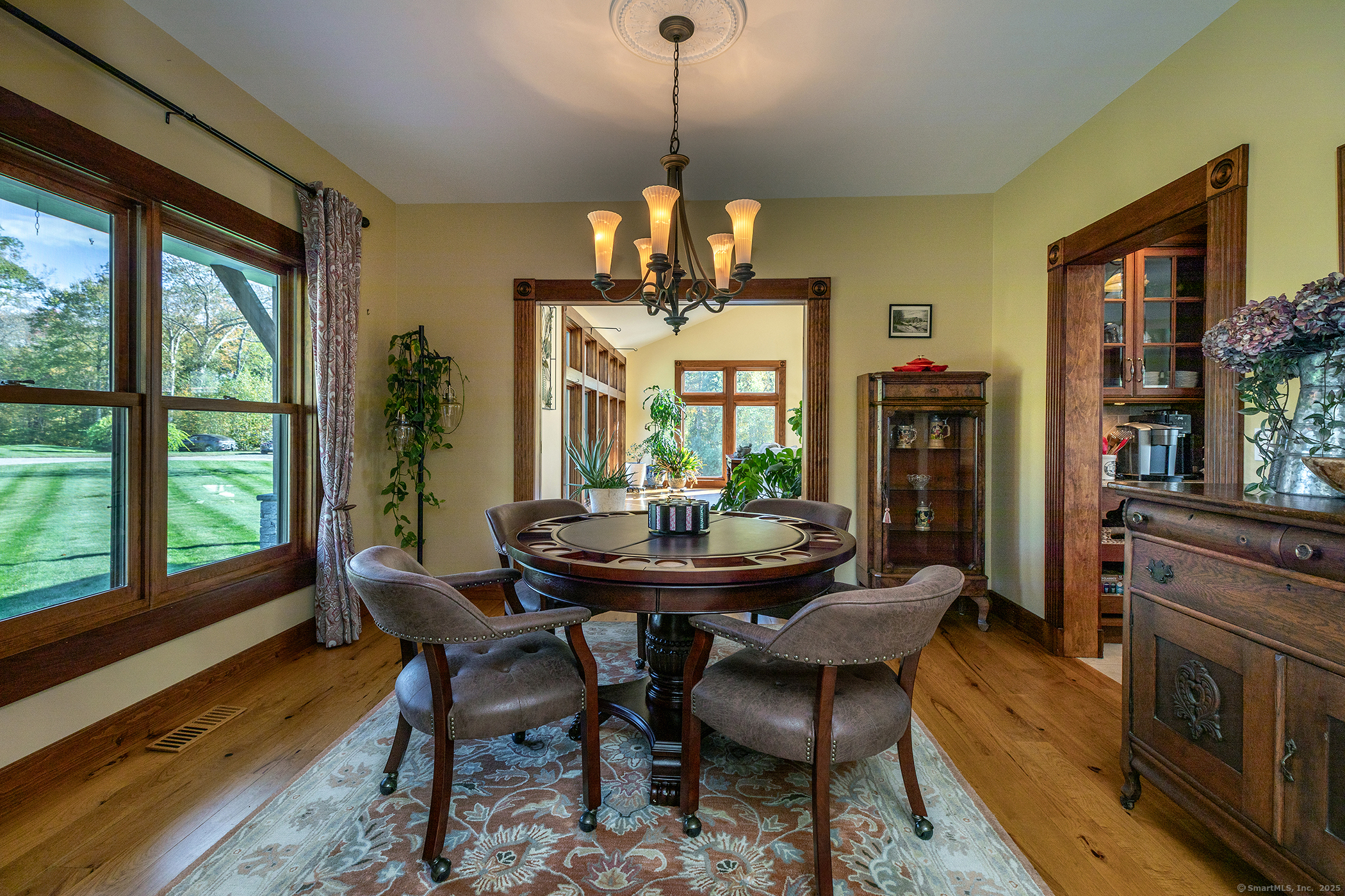 8 Bobcat Lane Warren, CT 06754 - Photo 29 of 40 a view of a dining room with furniture window and wooden floor