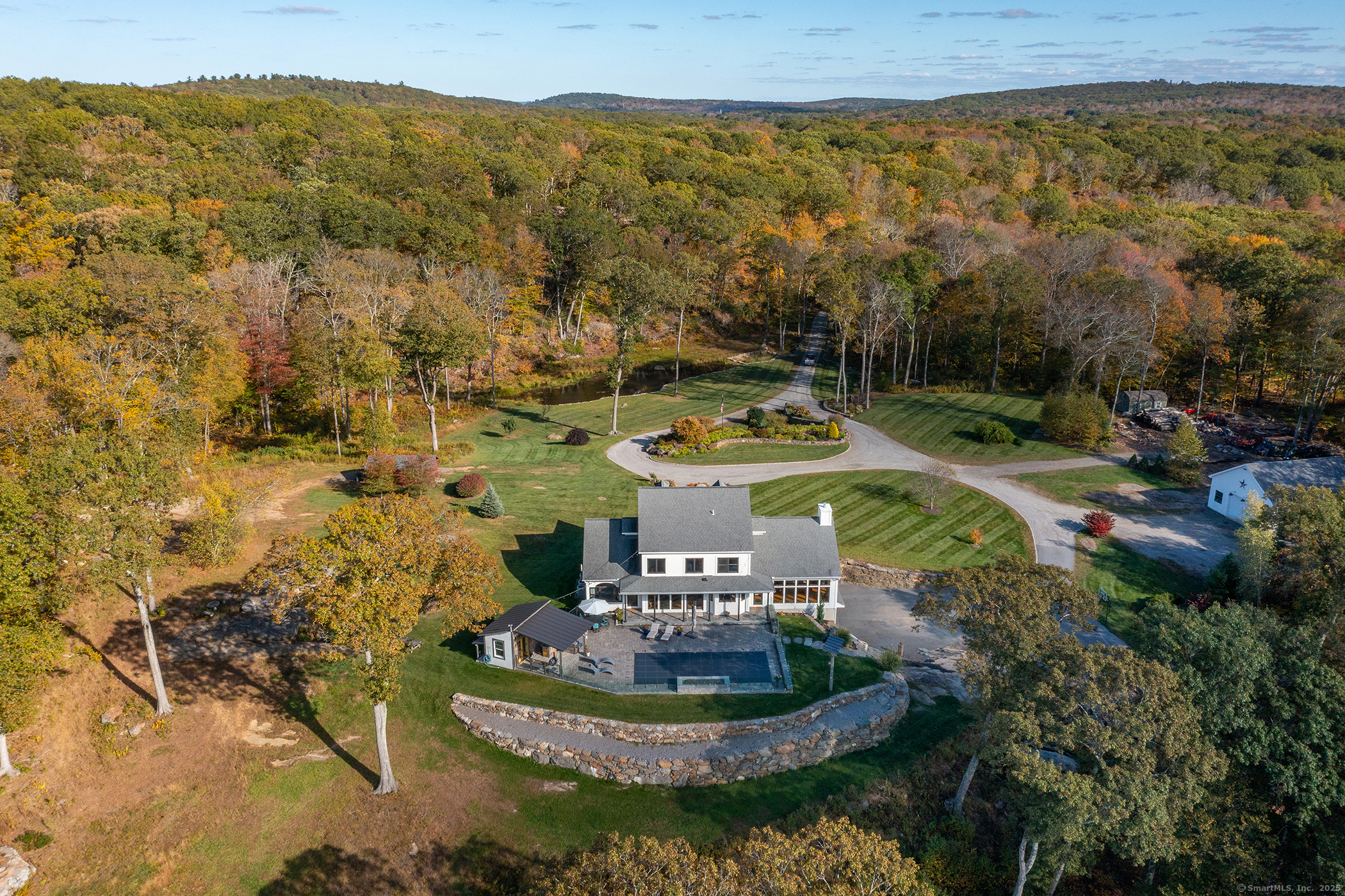 8 Bobcat Lane Warren, CT 06754 - Photo 3 of 40 a view of a water with a mountain in the back