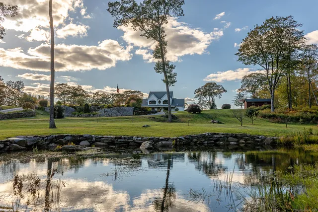 a view of a lake with a big yard