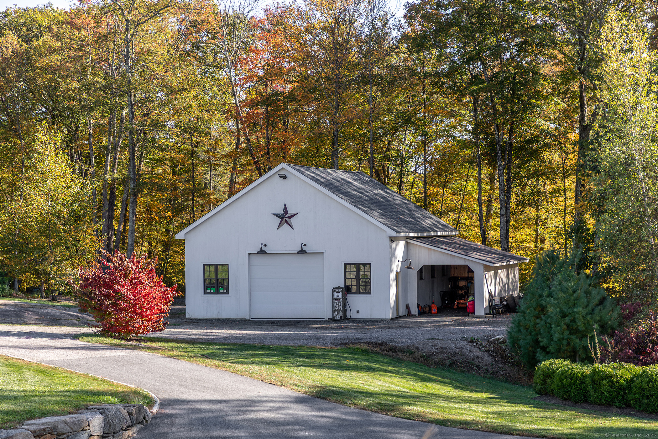 8 Bobcat Lane Warren, CT 06754 - Photo 37 of 40 a view of a white house with a big yard plants and large trees
