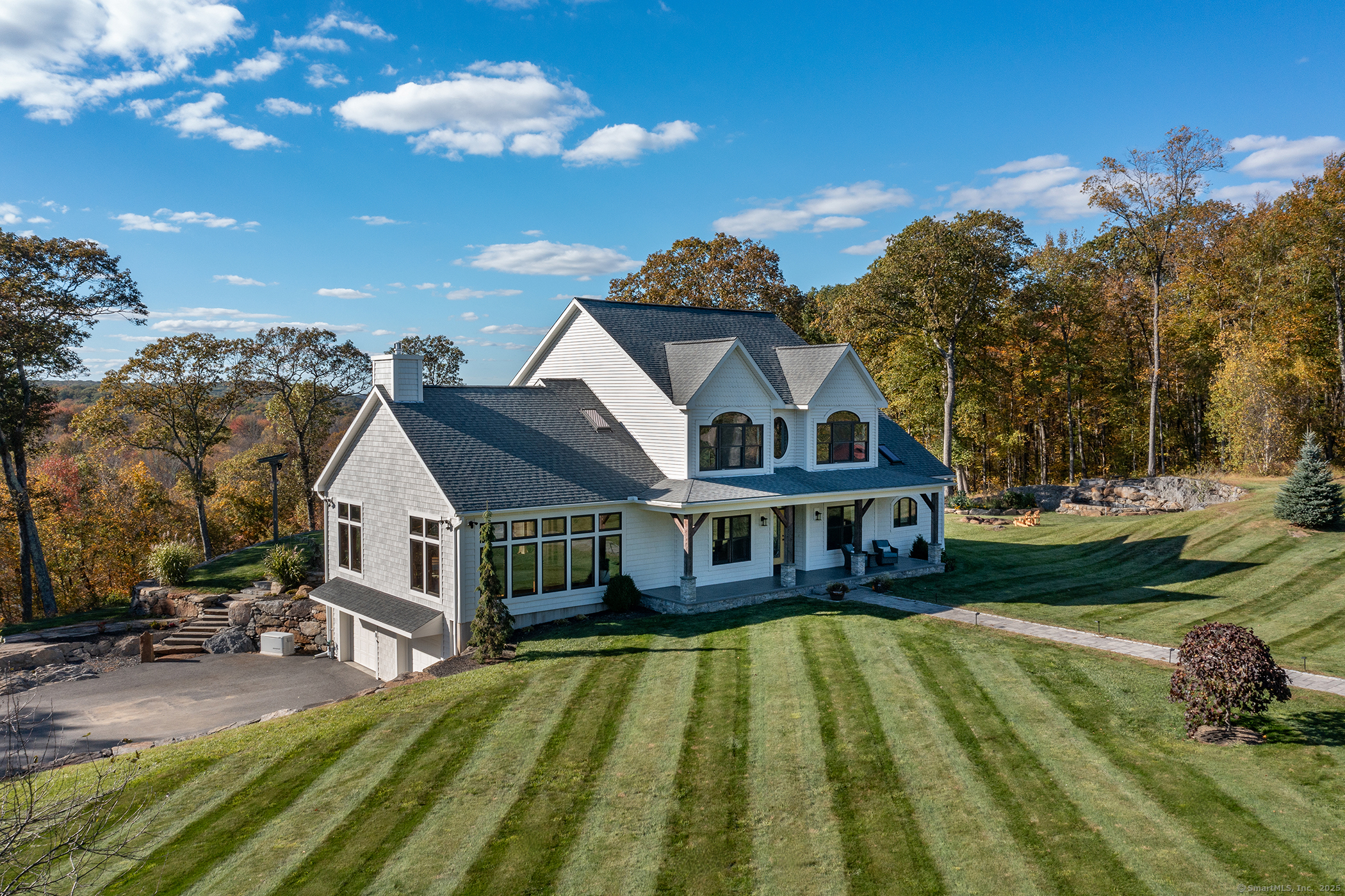 8 Bobcat Lane Warren, CT 06754 - Photo 5 of 40 a view of a house with a swimming pool