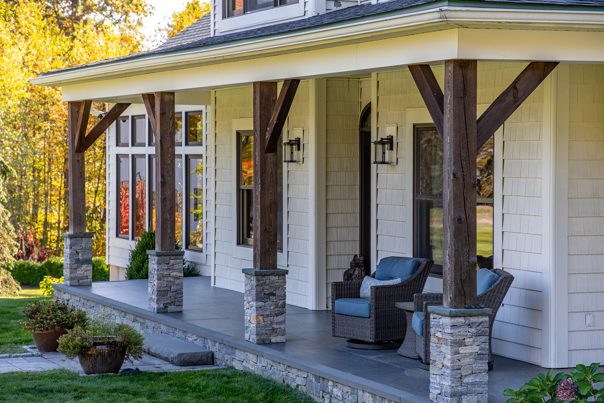 8 Bobcat Lane Warren, CT 06754 - Photo 6 of 40 a front view of a house with a garden