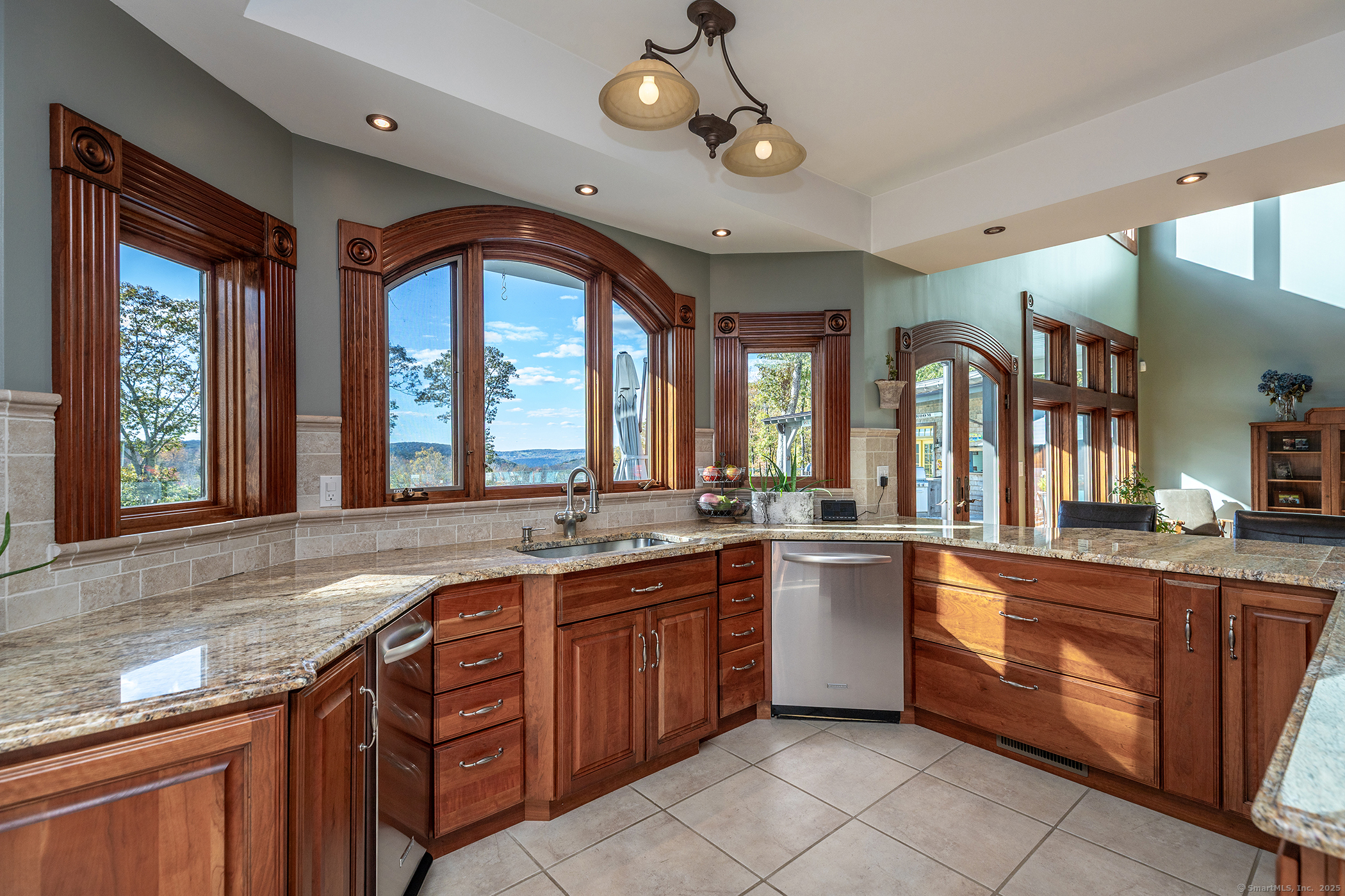 8 Bobcat Lane Warren, CT 06754 - Photo 7 of 40 a large kitchen with kitchen island granite countertop lots of counter space and a sink