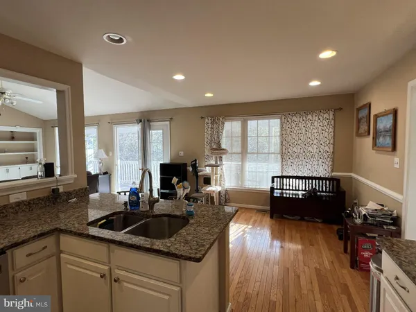 a view of a storage and utility room with refrigerator