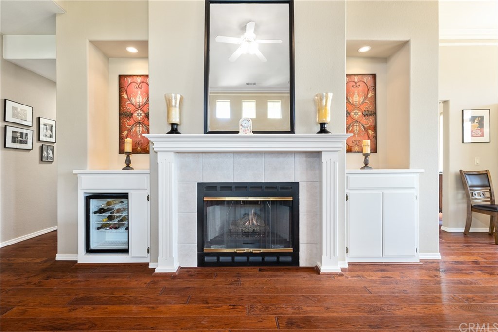 1612 Via Flora Paso Robles, CA 93446 - Photo 11 of 35 a living room with a fireplace with wooden floor