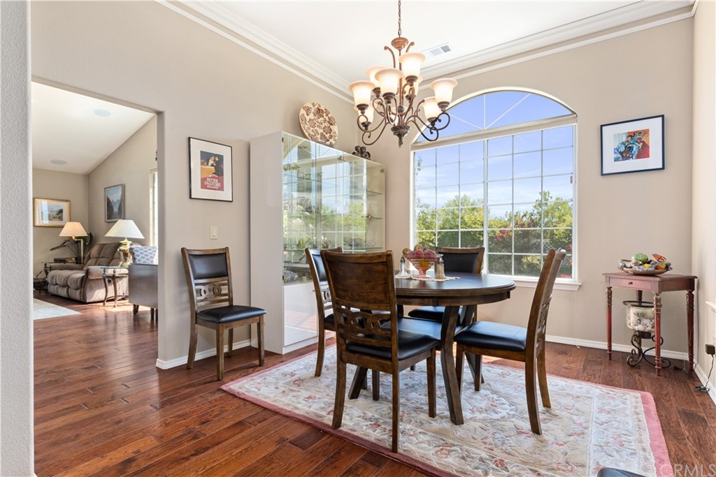1612 Via Flora Paso Robles, CA 93446 - Photo 12 of 35 a view of a dining room with furniture a chandelier and wooden floor