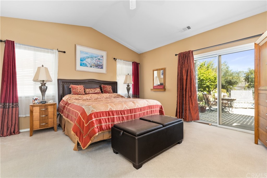 1612 Via Flora Paso Robles, CA 93446 - Photo 16 of 35 a spacious bedroom with a bed painting and a large window