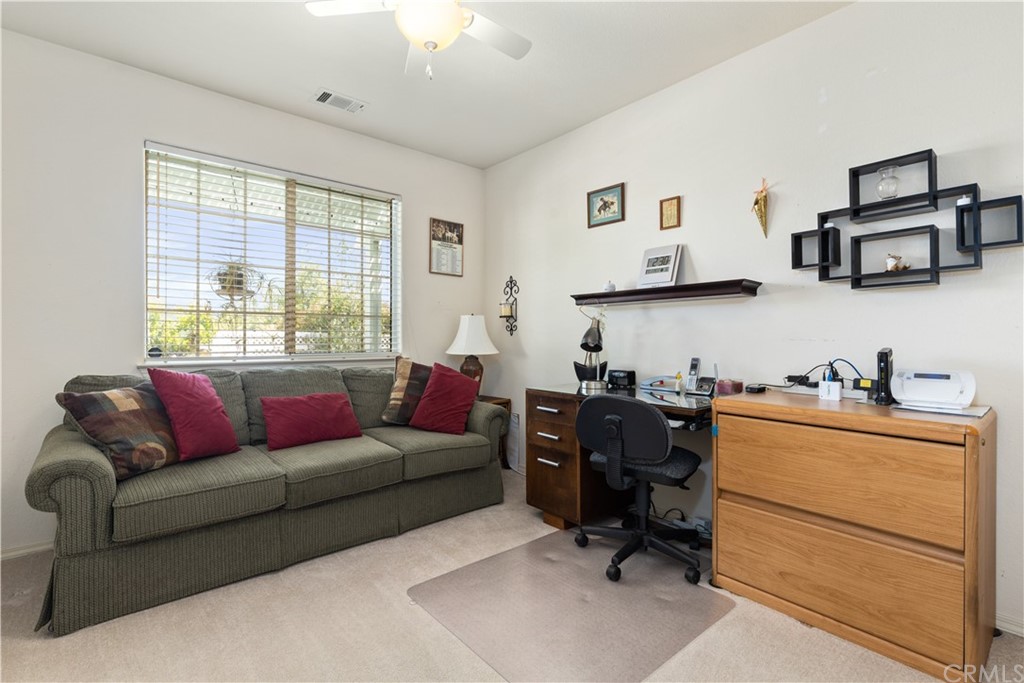 1612 Via Flora Paso Robles, CA 93446 - Photo 18 of 35 a living room with furniture and a window