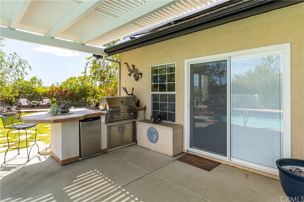 1612 Via Flora Paso Robles, CA 93446 - Photo 29 of 35 a kitchen with sink and refrigerator