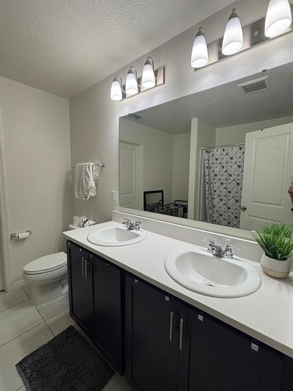 3166 Sweet Acrs Place St. Cloud, FL 34772 - Photo 11 of 27 a bathroom with a sink and a mirror