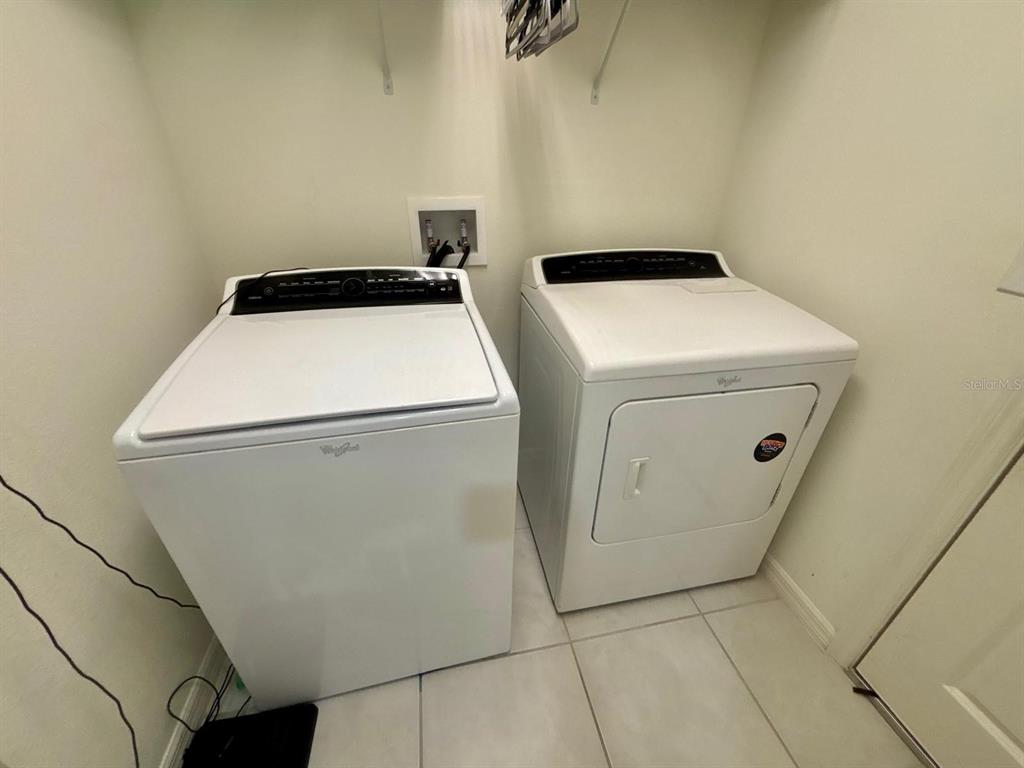 3166 Sweet Acrs Place St. Cloud, FL 34772 - Photo 20 of 27 a utility room with dryer and washer