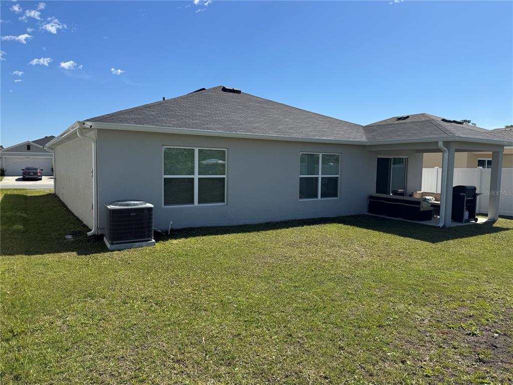 3166 Sweet Acrs Place St. Cloud, FL 34772 - Photo 23 of 27 a house view with a garden space