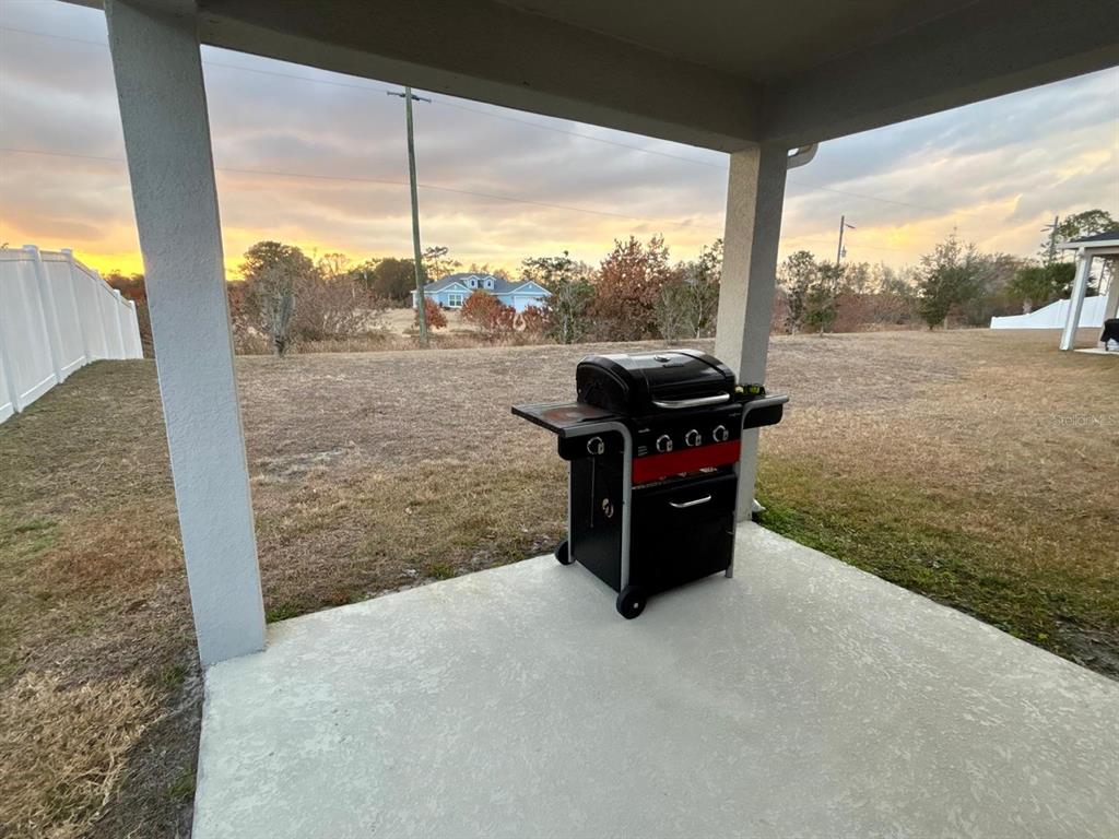 3166 Sweet Acrs Place St. Cloud, FL 34772 - Photo 25 of 27 a house view with a outdoor space and sitting space
