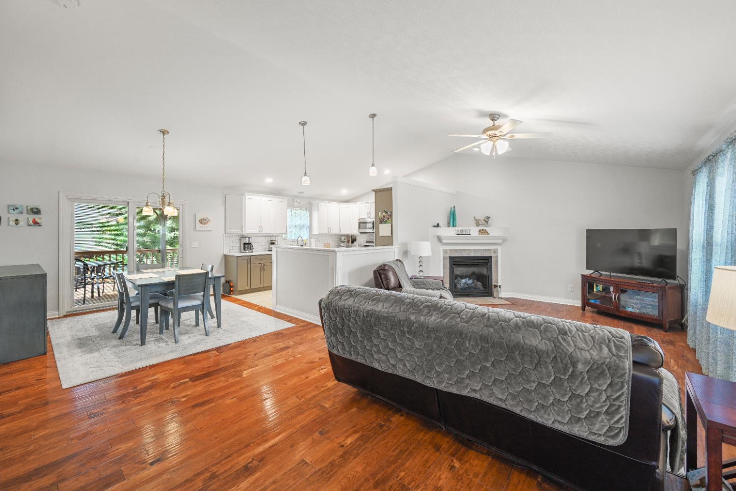 579 Hickory Road Lawrenceburg, IN 47025 - Photo 9 of 40 Open concept first floor with large living room with fire place that opens up into the updated eat-in kitchen with a walk out to the back deck!