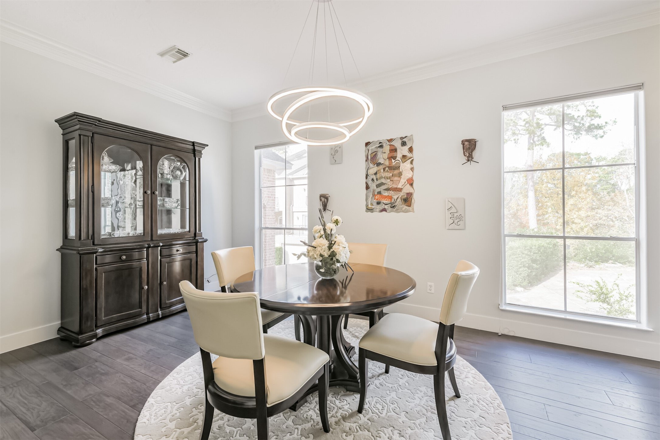 12636 Briar Patch Drive Houston, TX 77077 - Photo 17 of 43 The formal dining room has an updated light fixture, crown molding and engineered hardwood floors.