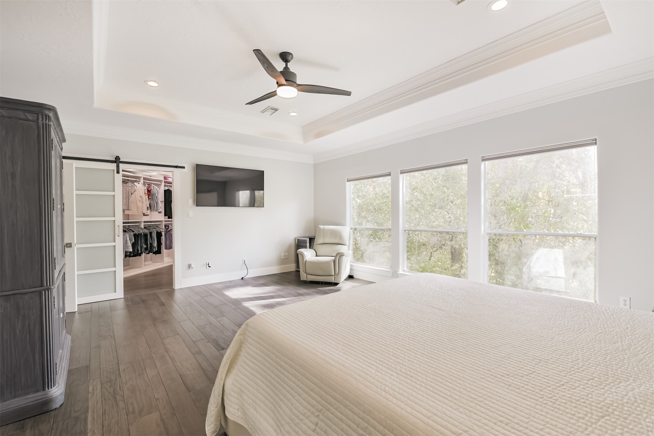 12636 Briar Patch Drive Houston, TX 77077 - Photo 23 of 43 There is a wall of windows in the primary suite with views of the wooded ravine/bayou.