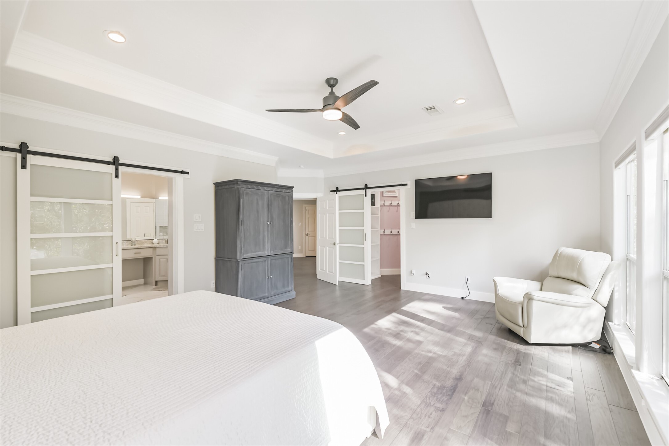 12636 Briar Patch Drive Houston, TX 77077 - Photo 24 of 43 The primary suite has two oversized walk-in closets, tray ceilings and an updated ceiling fan.