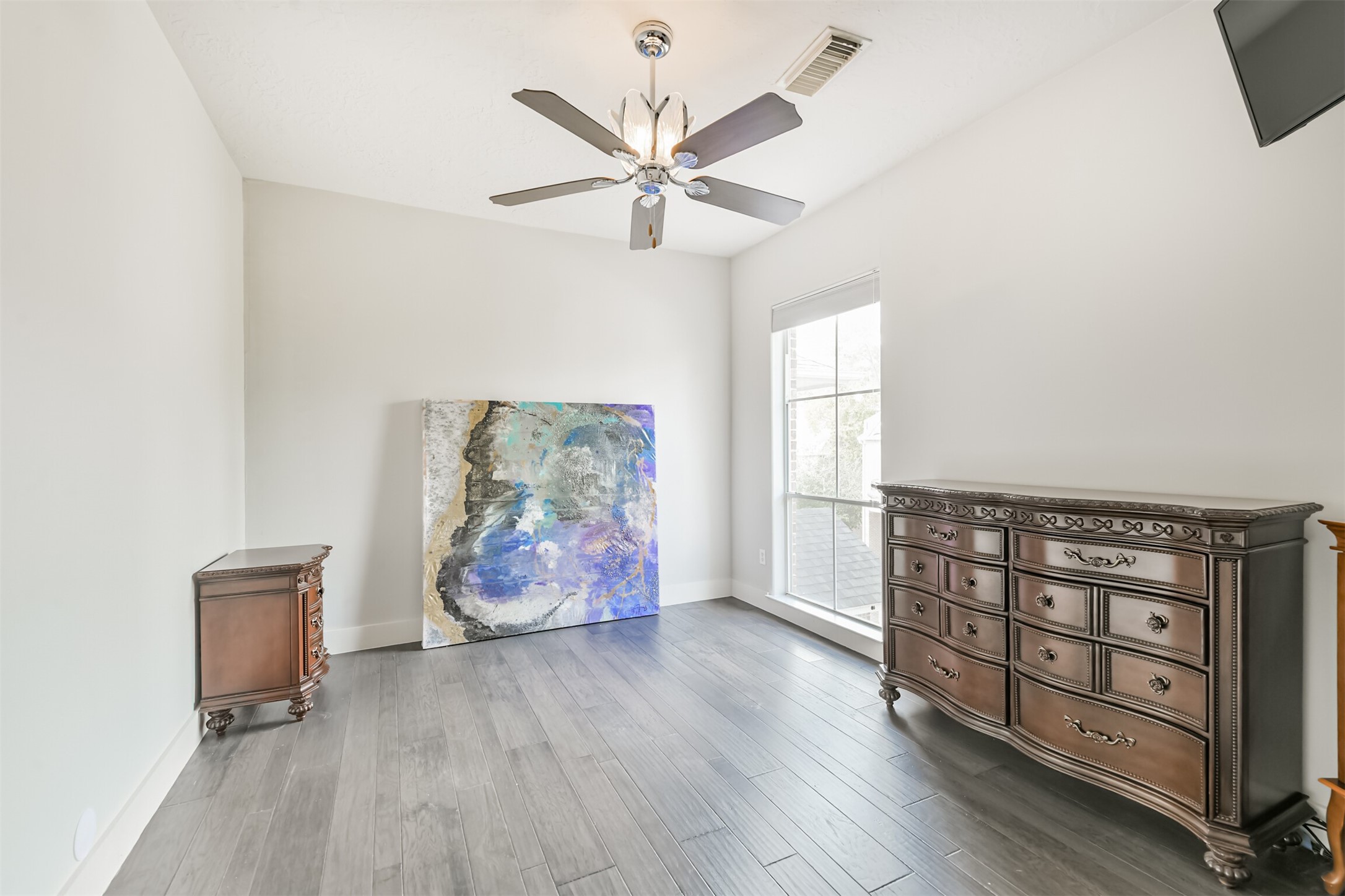 12636 Briar Patch Drive Houston, TX 77077 - Photo 29 of 43 The second bedroom is located on the third floor with tall ceilings and a ceiling fan.