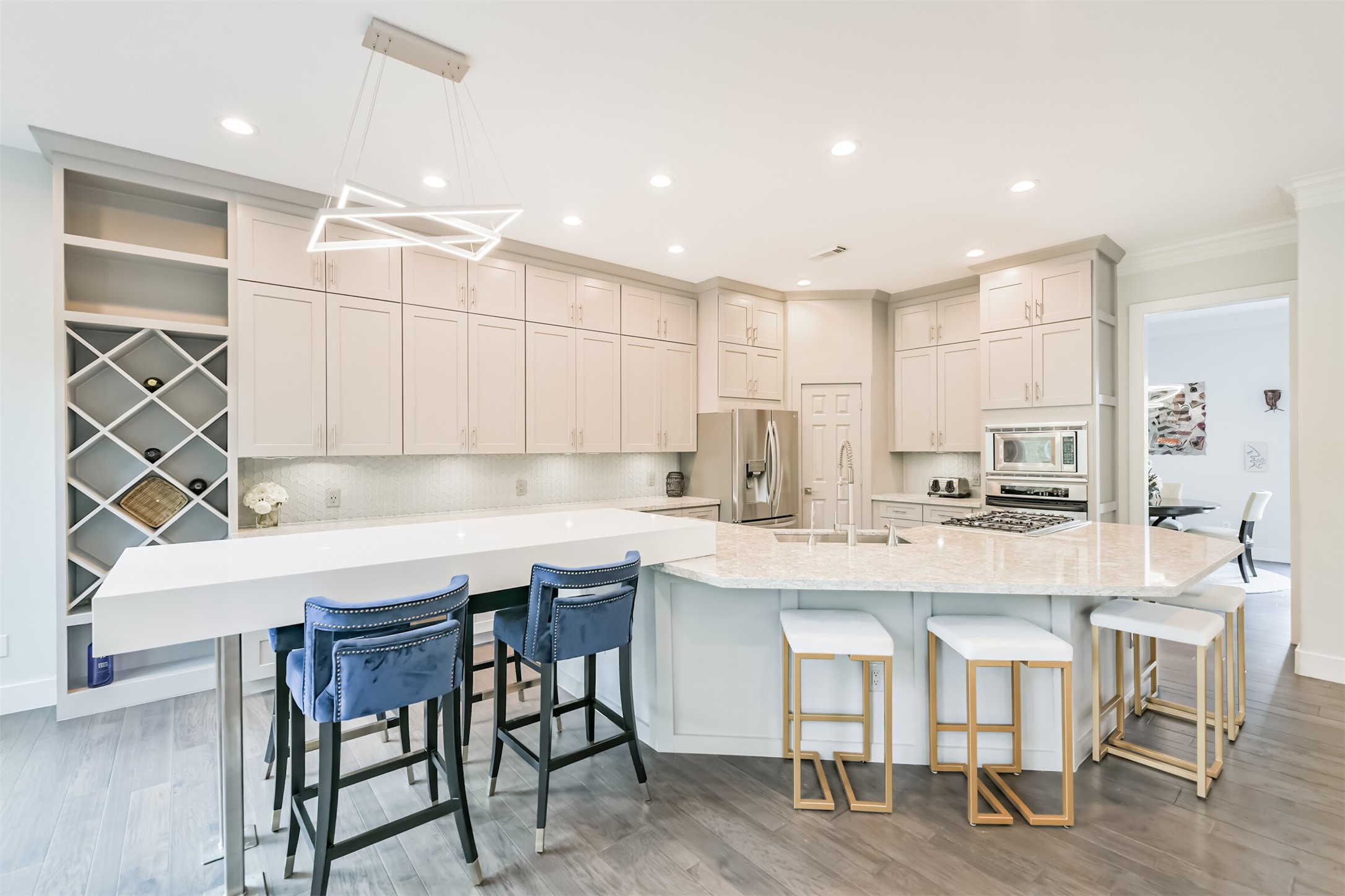 12636 Briar Patch Drive Houston, TX 77077 - Photo 9 of 43 The oversized island kitchen features granite counters with tile/glass backsplash, LED recessed lighting, Shaker style soft closing cabinets and drawers, under cabinet lighting and a walk-in pantry.