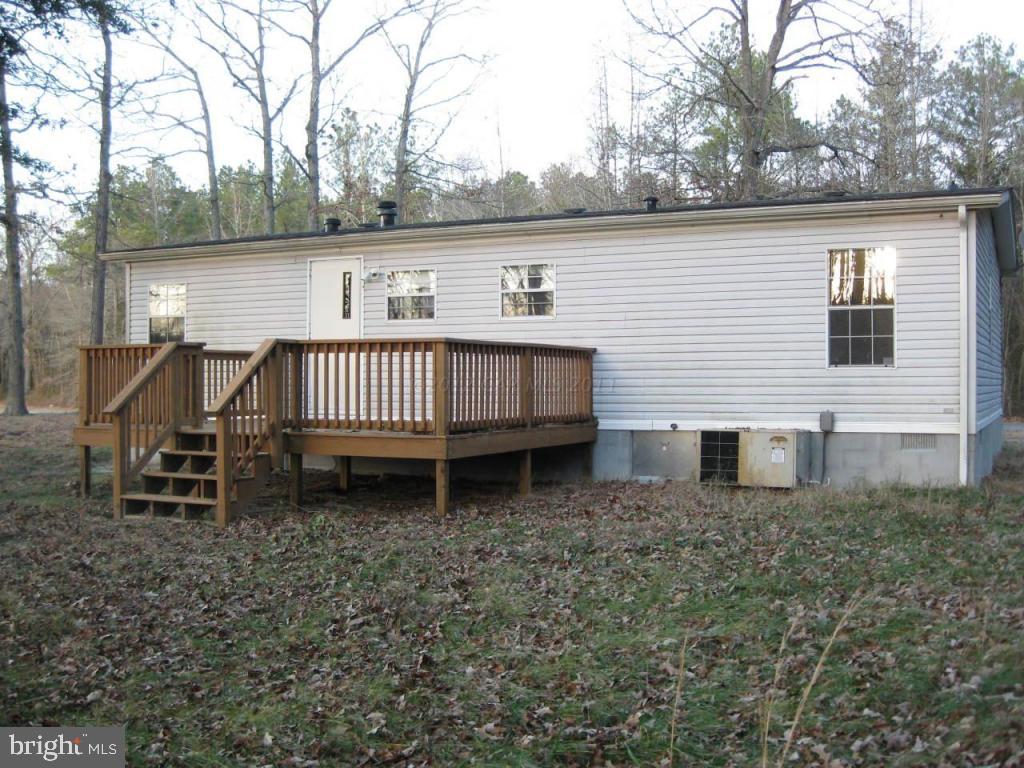 33233 Bob Smith Road Parsonsburg, MD 21849 - Photo 3 of 10 a view of a house with a yard and wooden fence