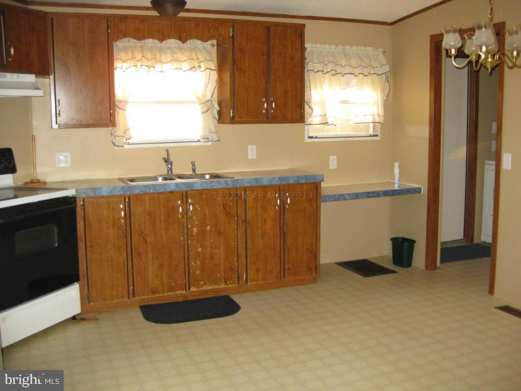 33233 Bob Smith Road Parsonsburg, MD 21849 - Photo 6 of 10 a kitchen with a sink a window and cabinets