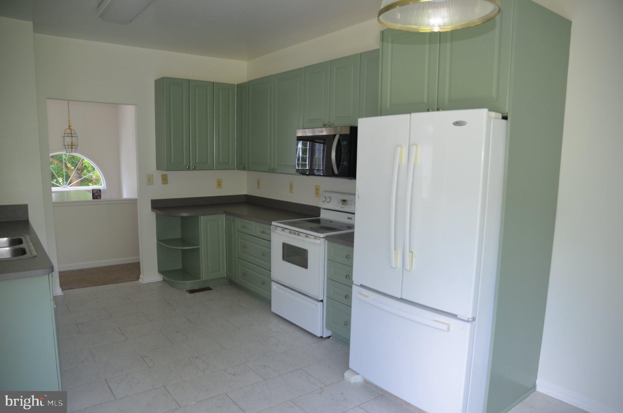 406 Longdraft Road Gaithersburg, MD 20878 - Photo 12 of 24 Charming kitchen with mint green cabinets.