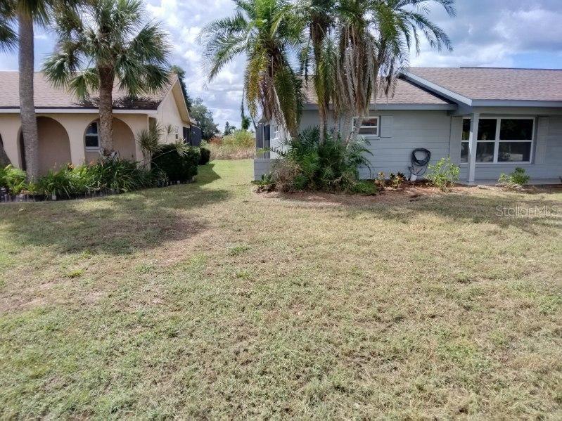 738 Flamingo Drive Apollo Beach, FL 33572 - Photo 2 of 15 a front view of a house with garden