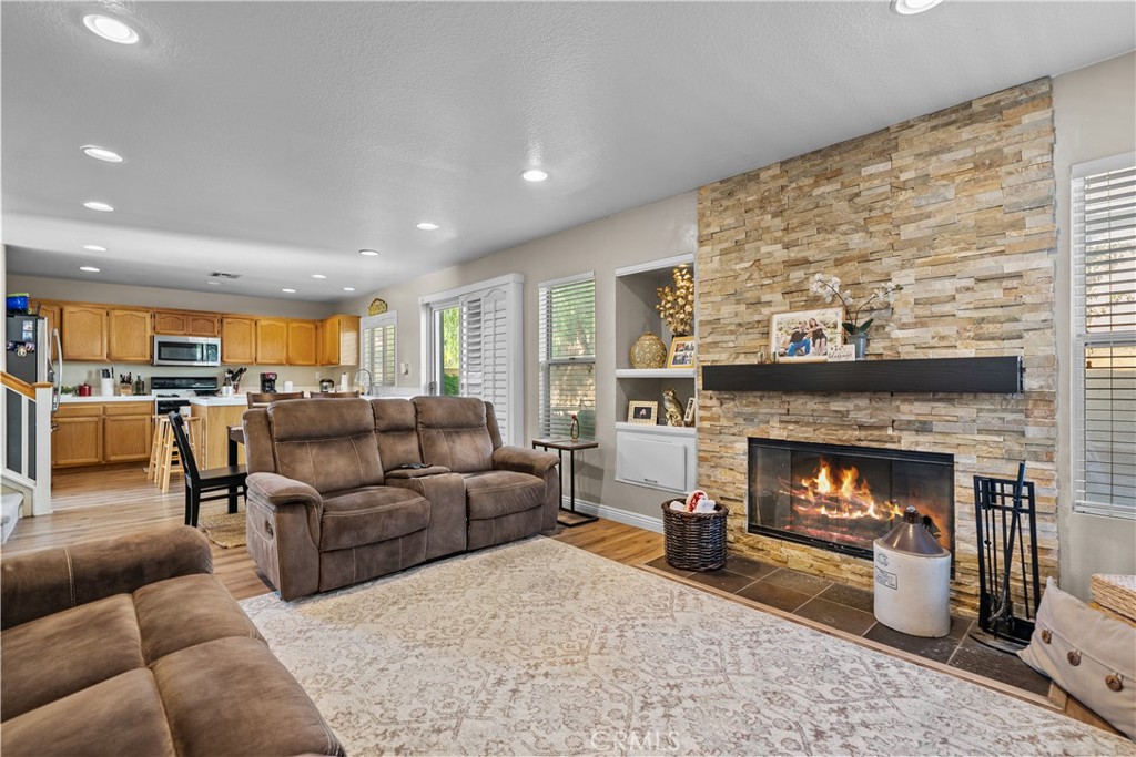 27687 Ron Ridge Drive Saugus, CA 91350 - Photo 11 of 50 a living room with furniture and a fireplace