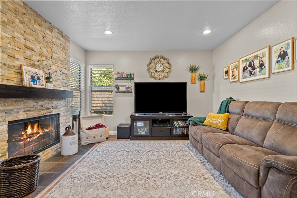 27687 Ron Ridge Drive Saugus, CA 91350 - Photo 13 of 50 a living room with furniture and a flat screen tv