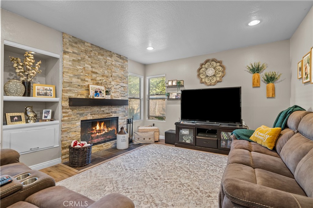 27687 Ron Ridge Drive Saugus, CA 91350 - Photo 14 of 50 a living room with furniture and a flat screen tv