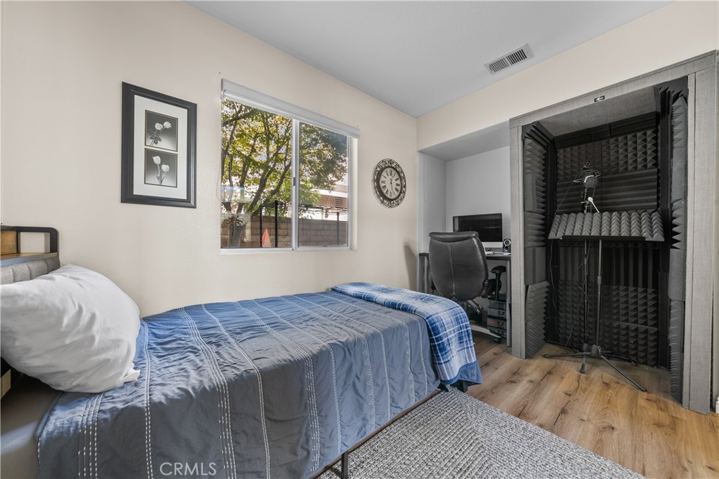 27687 Ron Ridge Drive Saugus, CA 91350 - Photo 15 of 50 a bedroom with a bed and a dresser