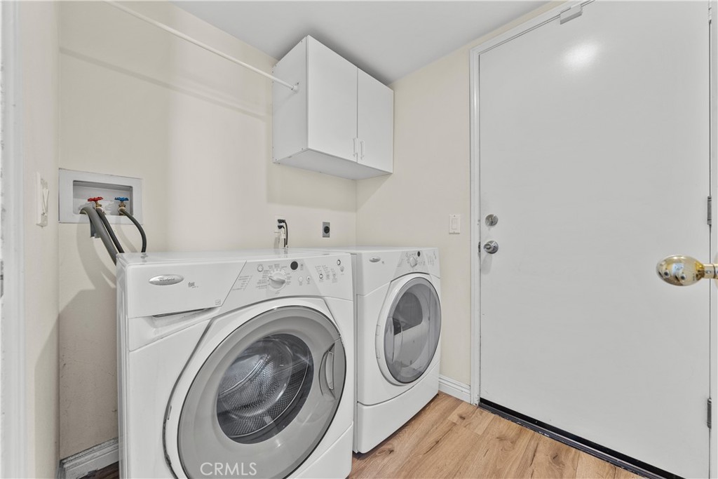 27687 Ron Ridge Drive Saugus, CA 91350 - Photo 16 of 50 a utility room with dryer and washer