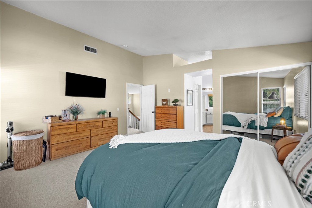 27687 Ron Ridge Drive Saugus, CA 91350 - Photo 20 of 50 a large bedroom with a bed and flat screen tv