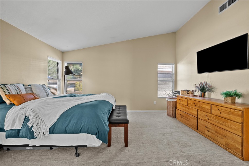 27687 Ron Ridge Drive Saugus, CA 91350 - Photo 22 of 50 a bedroom with a bed and a flat screen television