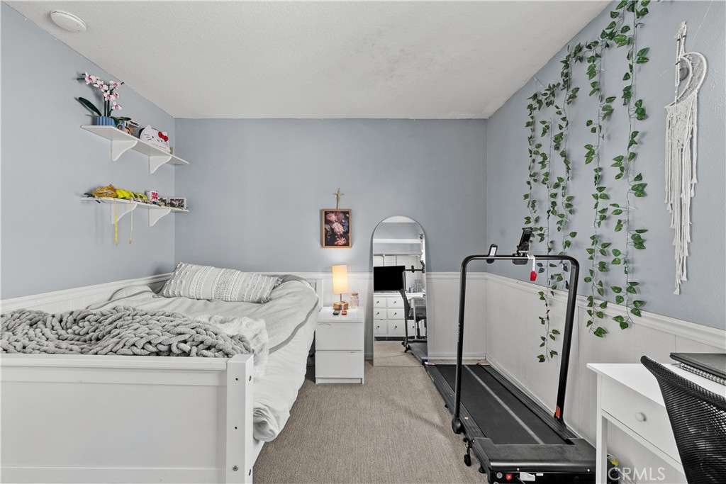 27687 Ron Ridge Drive Saugus, CA 91350 - Photo 35 of 50 a bed room with a bed and a chair