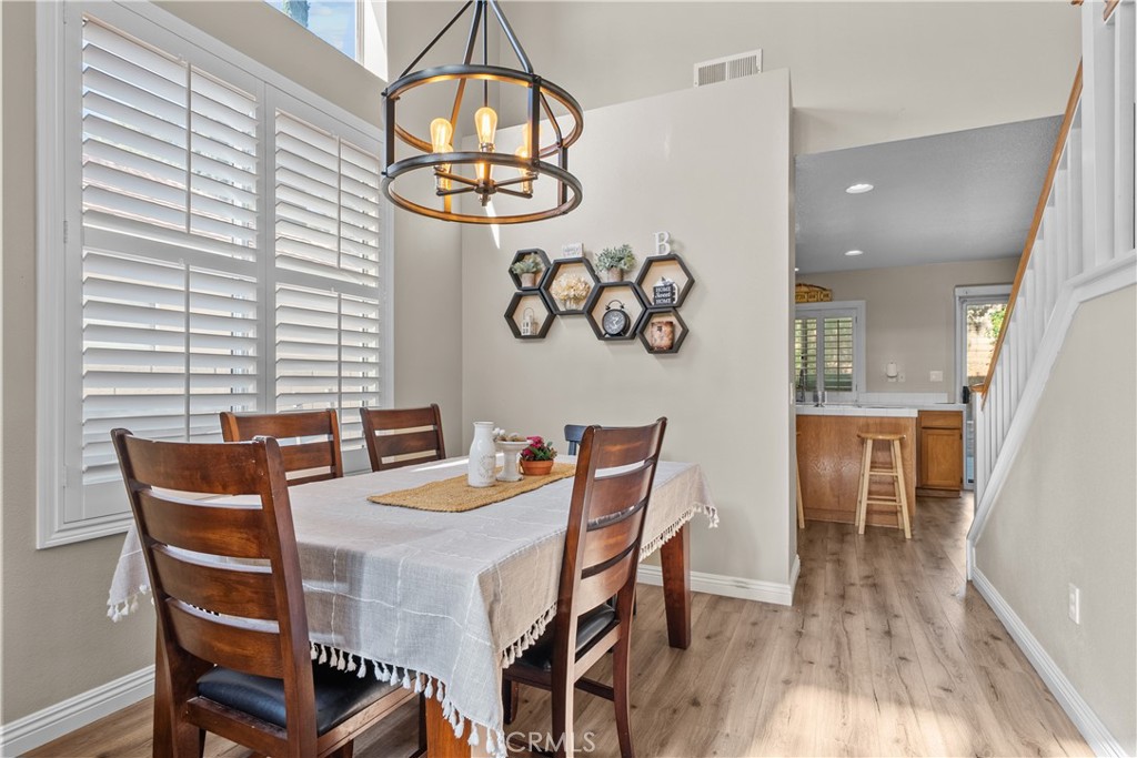 27687 Ron Ridge Drive Saugus, CA 91350 - Photo 6 of 50 a view of a dining room with furniture and wooden floor