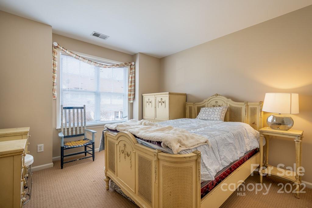 17341 Villanova Road Huntersville, NC 28078 - Photo 14 of 17 a bedroom with a bed and a window